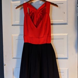 Open Back Bow dress with black mini skirt.